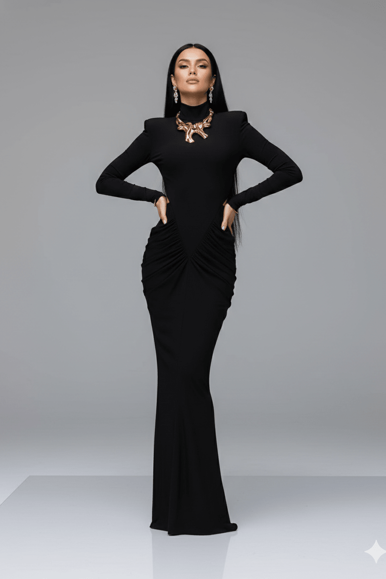 Ruched High - Neck Long Sleeve Bodycon Maxi Evening Dress by Luxe Lane | mermaid gown from Luxe Lane | SKU: -5 | Barcode:  | Options: Black S(6) | Woman wearing a black dress with a gold necklace on a gray background