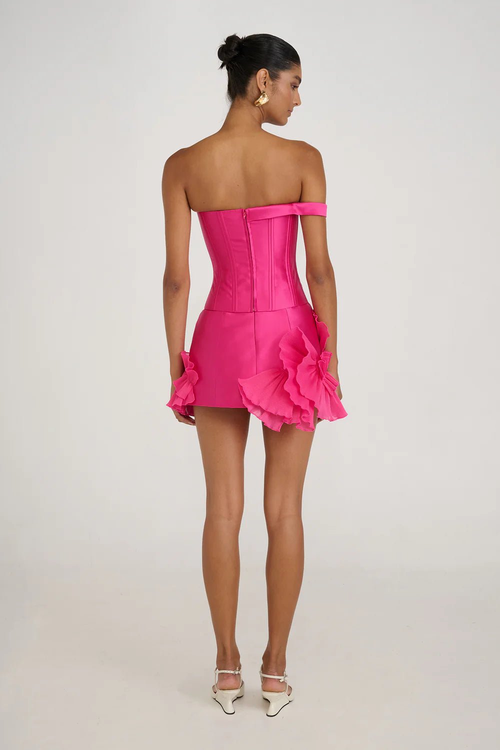 Satin Asymmetrical Mini Dress by Luxe Lane | from Luxe Lane | SKU:  | Barcode:  | Options: S | Woman wearing a pink strapless dress with ruffled details on a white background
