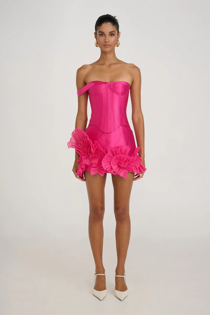 Satin Asymmetrical Mini Dress by Luxe Lane | from Luxe Lane | SKU:  | Barcode:  | Options: S | Woman wearing a pink strapless dress with ruffled sleeves on a white background