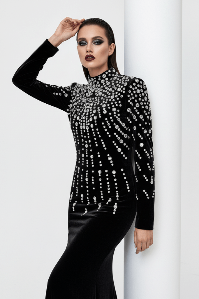 Seliora Velvet Rhinestone Mermaid Gown by luxe lane| mermaid gown from Luxe Lane | SKU: W11398-1 | Barcode:  | Options: Black S | Woman wearing a black top with silver embellishments against a white background