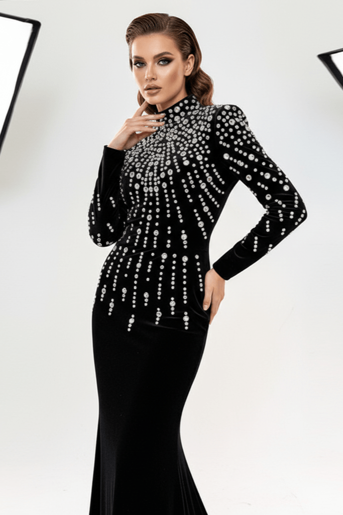 Seliora Velvet Rhinestone Mermaid Gown by luxe lane| mermaid gown from Luxe Lane | SKU: W11398-1 | Barcode:  | Options: Black S | Woman wearing a black evening gown with silver embellishments against a white background