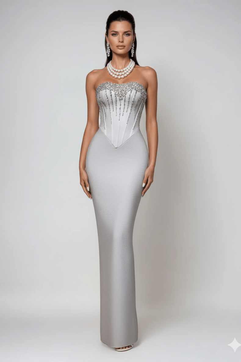 Strapless Rhinestone Corset Maxi Gown by Shine | Party dresses from Luxe Lane | SKU: -1 | Barcode:  | Options: Light gray XS(4) | Woman wearing a silver evening gown with beaded details on a white background