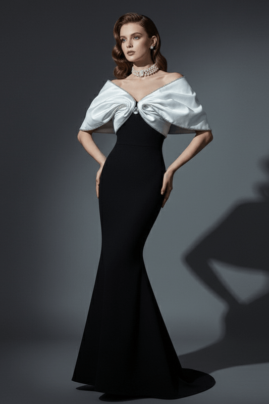 Strapless Satin Bow Mermaid Evening Gown by Y&H | mermaid gown from Luxe Lane | SKU: -1 | Barcode:  | Options: Black S(6) | Woman wearing a black evening gown with a white bow detail on a gray background