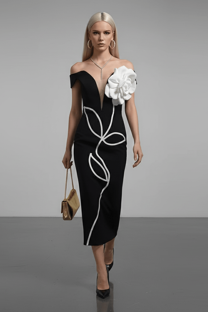 V - Neck Bandage Dress with Flower Detail by Shine | tea - length gown from Luxe Lane | SKU: -1 | Barcode:  | Options: Black S(6) | Woman wearing a black off - shoulder dress with white floral details on a gray background