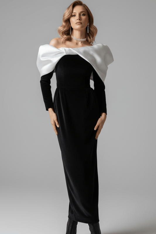 V - Neck Bow Detail Bodycon Maxi Dress by Luxe Lane | Dresses from Luxe Lane | SKU: -1 | Barcode:  | Options: Black XS | Woman wearing a black and white dress with a large bow on a gray background