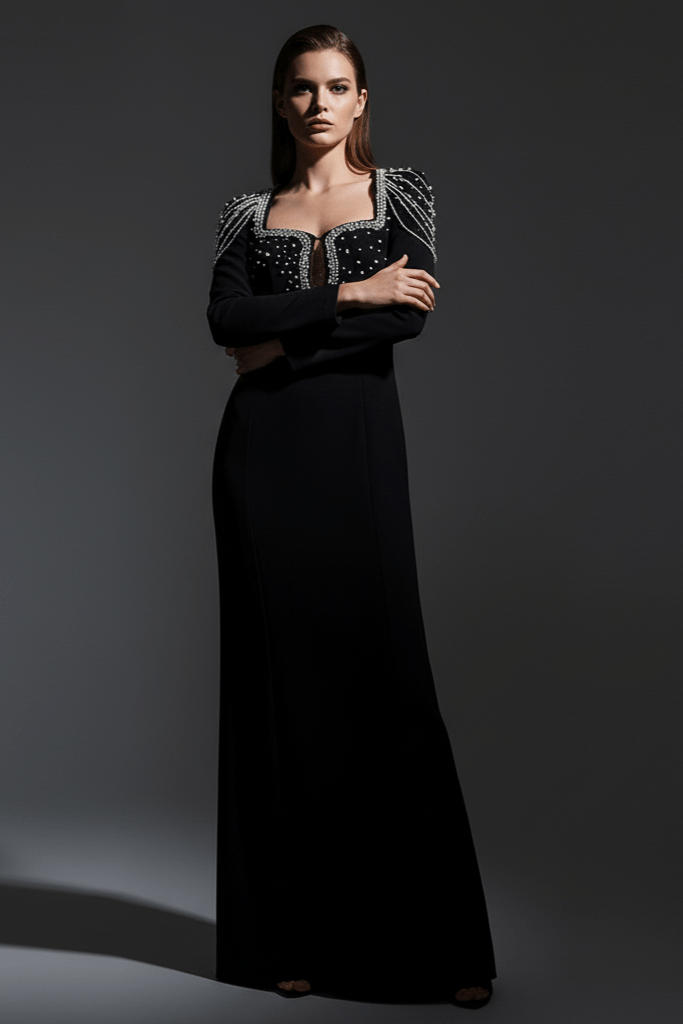 Valentina Embellished Evening Gown by Luxe Lane | Formal Gown from Luxe Lane | SKU:  | Barcode:  | Options: Black S | Woman wearing a black evening gown with intricate detailing on a gray background