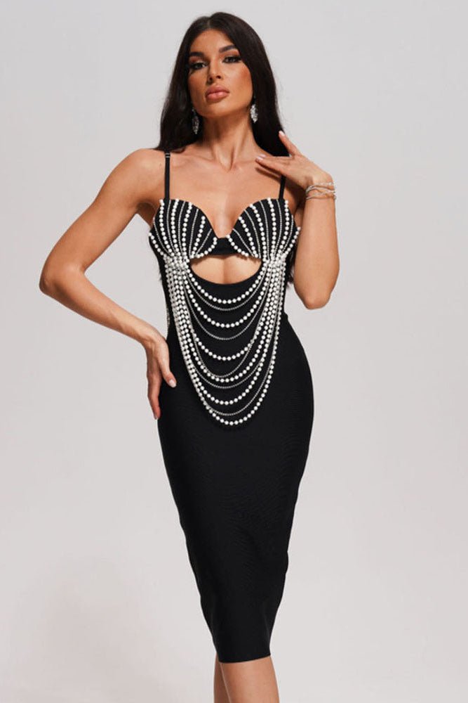 Vienna Pearl Chain Tassel Bandage Dress by Luxe Lane | from Luxe Lane | SKU:  | Barcode:  | Options: Black XS | model posing front view in Luxe Lane black Vienna dress with pearl chain tassel detailing