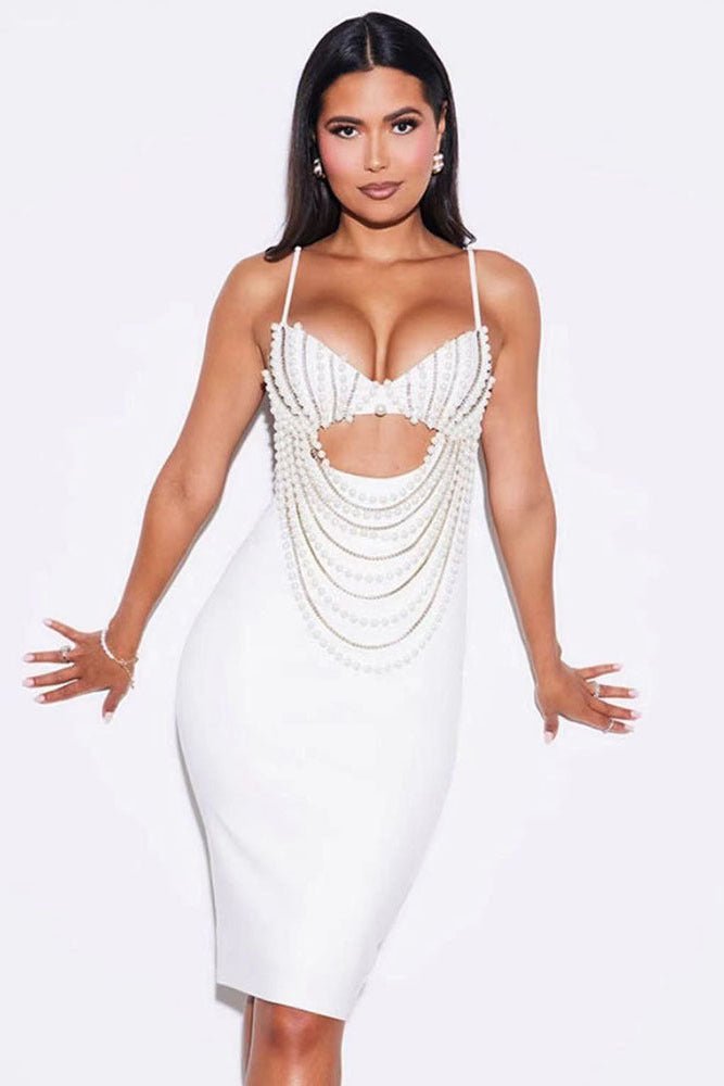 Vienna Pearl Chain Tassel Bandage Dress by Luxe Lane | from Luxe Lane | SKU:  | Barcode:  | Options: White XS | walking pose of model in Luxe Lane white pearl - embellished bandage dress with layered chain detailing