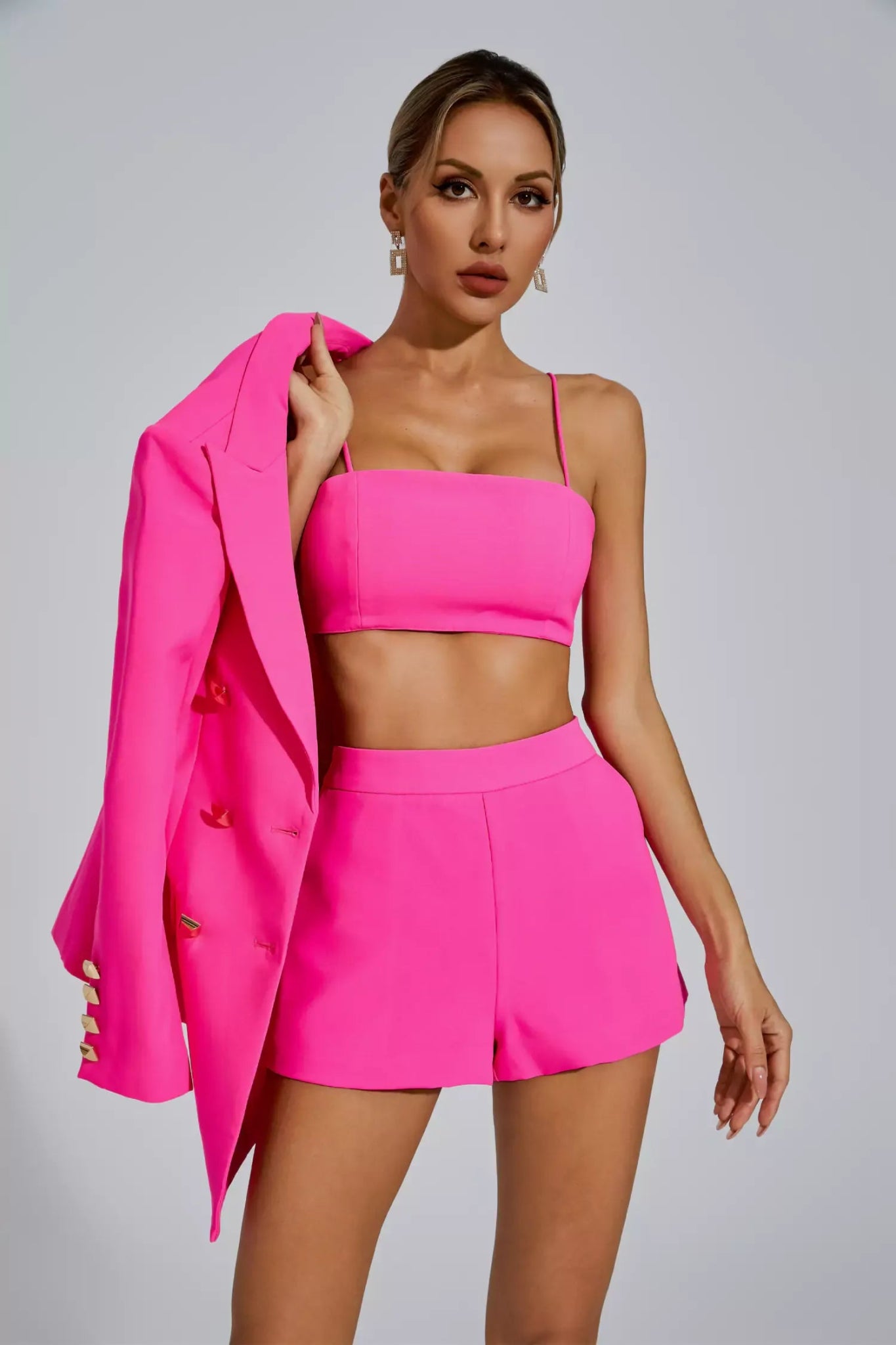 Vienna Structured Blazer & Shorts 3 - Piece Set by Luxe Lane | 3 set from Luxe Lane | SKU:  | Barcode:  | Options: White S | Woman wearing a bright pink outfit with a blazer on a gray background